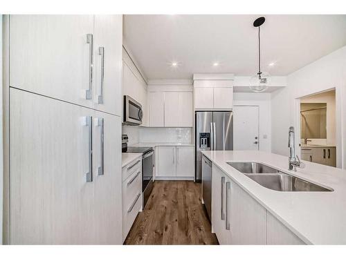 2211-681 Savanna Boulevard Ne, Calgary, AB - Indoor Photo Showing Kitchen With Stainless Steel Kitchen With Double Sink With Upgraded Kitchen