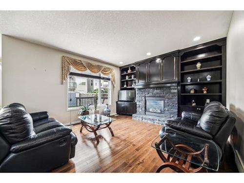 456 Hidden Creek Boulevard Nw, Calgary, AB - Indoor Photo Showing Living Room With Fireplace