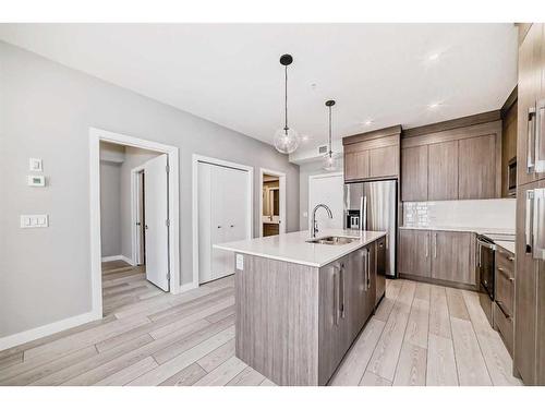 2219-681 Savanna Boulevard, Calgary, AB - Indoor Photo Showing Kitchen With Stainless Steel Kitchen With Upgraded Kitchen