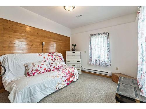 411 1A Avenue Sw, Diamond Valley, AB - Indoor Photo Showing Bedroom