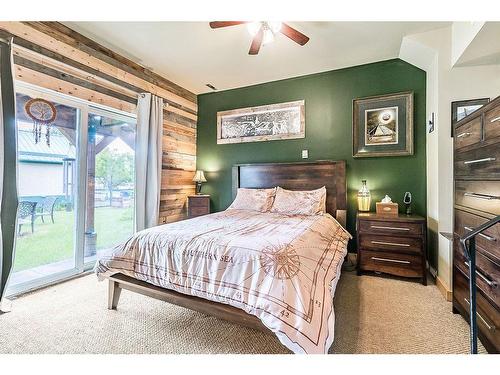 411 1A Avenue Sw, Diamond Valley, AB - Indoor Photo Showing Bedroom