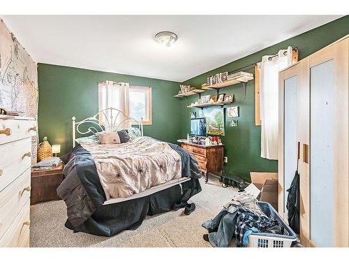 411 1A Avenue Sw, Diamond Valley, AB - Indoor Photo Showing Bedroom