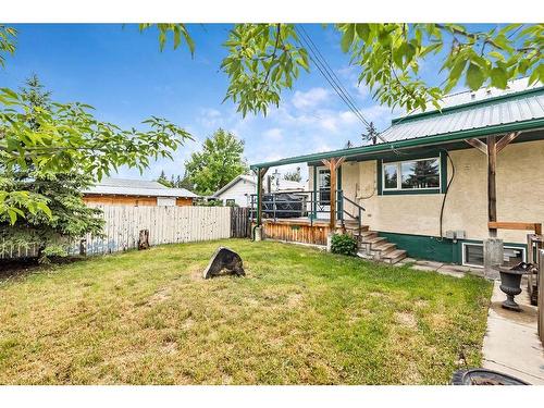 411 1A Avenue Sw, Diamond Valley, AB - Outdoor With Deck Patio Veranda