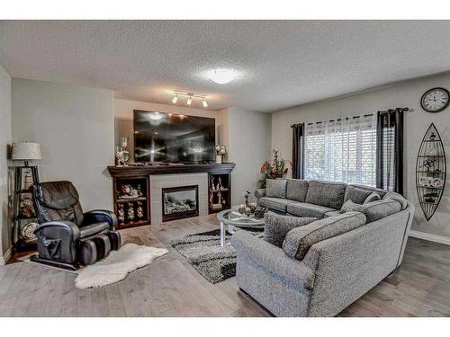 182 Sherwood Mount Nw, Calgary, AB - Indoor Photo Showing Living Room With Fireplace