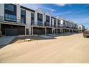 249 Sovereign Common Sw, Calgary, AB  - Outdoor With Balcony With Facade 