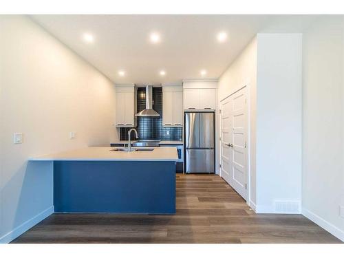 249 Sovereign Common Sw, Calgary, AB - Indoor Photo Showing Kitchen With Double Sink