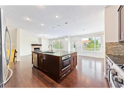 406 Silverado Way Sw, Calgary, AB - Indoor Photo Showing Kitchen With Double Sink With Upgraded Kitchen