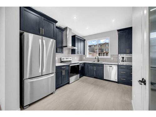 63 Marmot Way Nw, Calgary, AB - Indoor Photo Showing Kitchen With Upgraded Kitchen