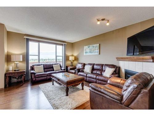 439 Cranfield Gardens Se, Calgary, AB - Indoor Photo Showing Living Room With Fireplace