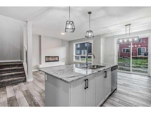 157 Belmont Villas Sw, Calgary, AB - Indoor Photo Showing Kitchen With Double Sink With Upgraded Kitchen