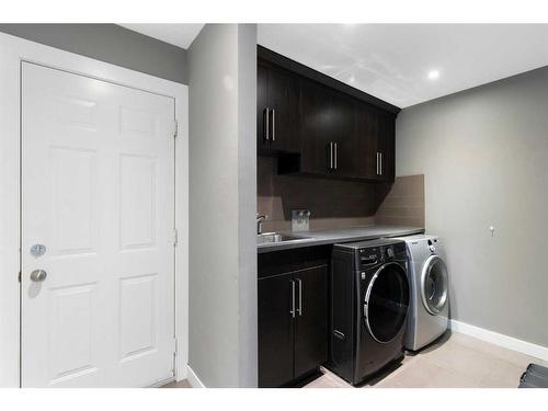 1396 Shawnee Road Sw, Calgary, AB - Indoor Photo Showing Laundry Room