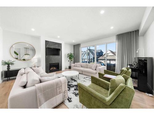 242 Sage Meadows Green Nw, Calgary, AB - Indoor Photo Showing Living Room With Fireplace