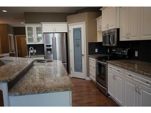 107 New Brighton Mews Se, Calgary, AB - Indoor Photo Showing Kitchen With Double Sink