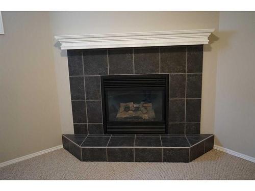 107 New Brighton Mews Se, Calgary, AB - Indoor Photo Showing Living Room With Fireplace
