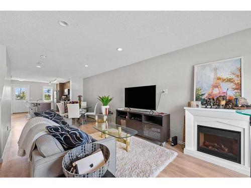 618 Cranford Mews Se, Calgary, AB - Indoor Photo Showing Living Room With Fireplace