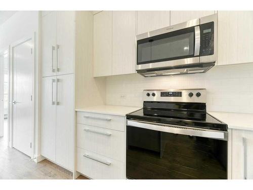 2208-681 Savanna Boulevard Ne, Calgary, AB - Indoor Photo Showing Kitchen