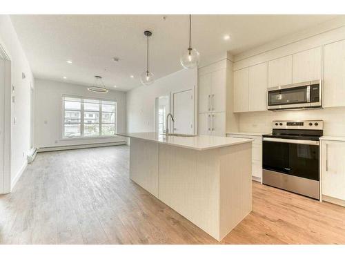 2208-681 Savanna Boulevard Ne, Calgary, AB - Indoor Photo Showing Kitchen With Upgraded Kitchen