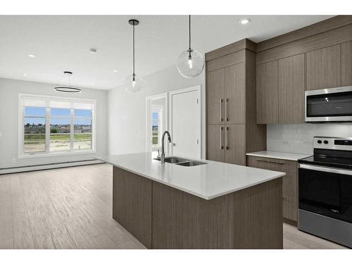 2304-681 Savanna Boulevard Ne, Calgary, AB - Indoor Photo Showing Kitchen With Double Sink With Upgraded Kitchen