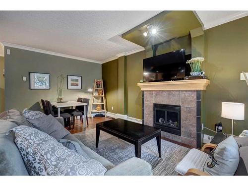 102-1225 15 Avenue Sw, Calgary, AB - Indoor Photo Showing Living Room With Fireplace