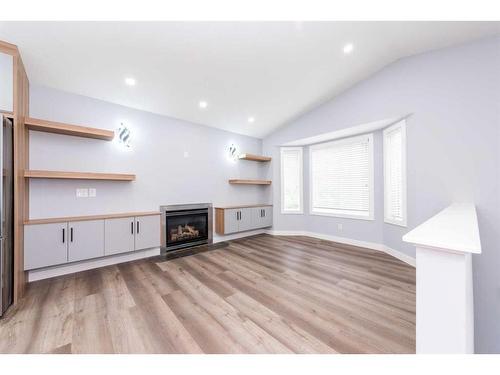 127 Saddlemont Crescent Ne, Calgary, AB - Indoor Photo Showing Living Room With Fireplace