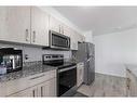 4202-4641 128 Avenue Ne, Calgary, AB  - Indoor Photo Showing Kitchen With Stainless Steel Kitchen With Upgraded Kitchen 