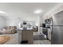 4202-4641 128 Avenue Ne, Calgary, AB  - Indoor Photo Showing Kitchen With Stainless Steel Kitchen 