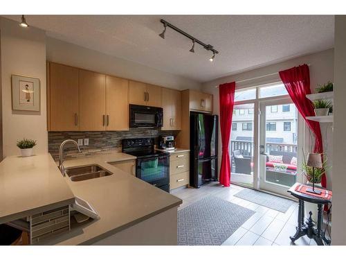 6 Walden Walk Se, Calgary, AB - Indoor Photo Showing Kitchen With Double Sink