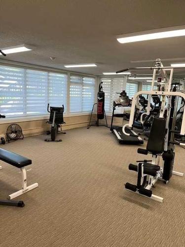 107-511 56 Avenue Sw, Calgary, AB - Indoor Photo Showing Gym Room