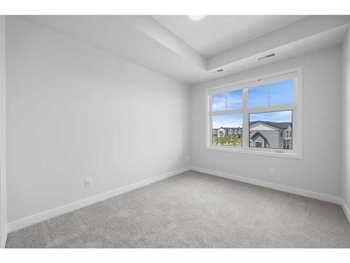 324-255 Les Jardins Park Se, Calgary, AB - Indoor Photo Showing Other Room