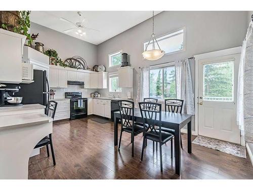 8 Crystal Shores Cove, Okotoks, AB - Indoor Photo Showing Dining Room