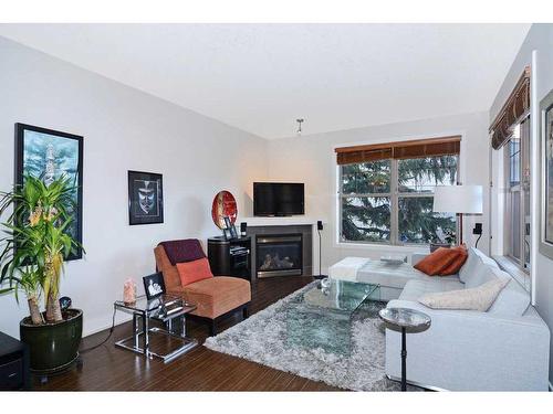 302-3704 15A Street Sw, Calgary, AB - Indoor Photo Showing Living Room With Fireplace