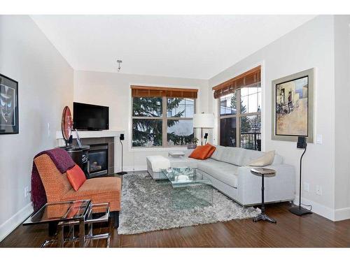 302-3704 15A Street Sw, Calgary, AB - Indoor Photo Showing Living Room With Fireplace