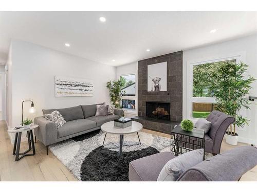 140 Lake Wapta Rise Se, Calgary, AB - Indoor Photo Showing Living Room With Fireplace