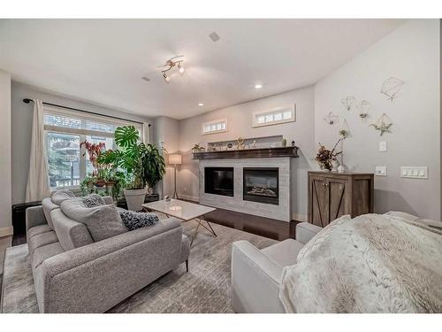 1-1621 27 Avenue Sw, Calgary, AB - Indoor Photo Showing Living Room With Fireplace
