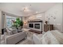 1-1621 27 Avenue Sw, Calgary, AB  - Indoor Photo Showing Living Room With Fireplace 