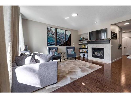 200 Evanswood Circle Nw, Calgary, AB - Indoor Photo Showing Living Room With Fireplace