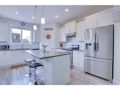 408 South Point Glen Sw, Airdrie, AB - Indoor Photo Showing Kitchen With Upgraded Kitchen