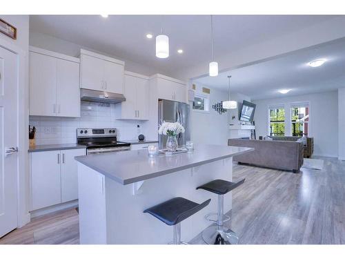 408 South Point Glen Sw, Airdrie, AB - Indoor Photo Showing Kitchen With Upgraded Kitchen