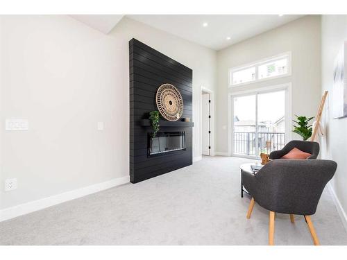 148 Saddlelake Manor Ne, Calgary, AB - Indoor Photo Showing Other Room With Fireplace