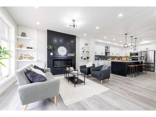 148 Saddlelake Manor Ne, Calgary, AB - Indoor Photo Showing Living Room With Fireplace