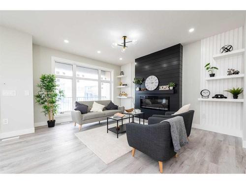 148 Saddlelake Manor Ne, Calgary, AB - Indoor Photo Showing Living Room With Fireplace