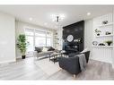 148 Saddlelake Manor Ne, Calgary, AB  - Indoor Photo Showing Living Room With Fireplace 