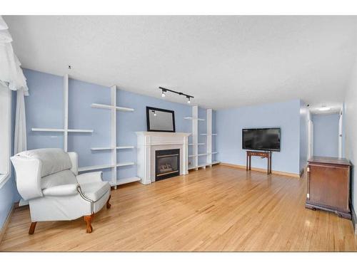 3939 19 Avenue Sw, Calgary, AB - Indoor Photo Showing Living Room With Fireplace