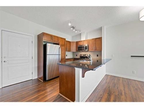 308-76 Panatella Road Nw, Calgary, AB - Indoor Photo Showing Kitchen With Double Sink