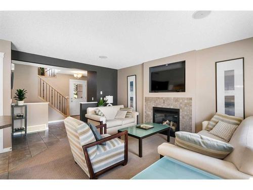 69 Bridleridge View Sw, Calgary, AB - Indoor Photo Showing Living Room With Fireplace