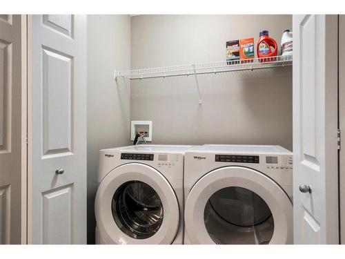 69 Bridleridge View Sw, Calgary, AB - Indoor Photo Showing Laundry Room