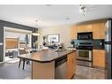 69 Bridleridge View Sw, Calgary, AB  - Indoor Photo Showing Kitchen With Stainless Steel Kitchen With Double Sink 