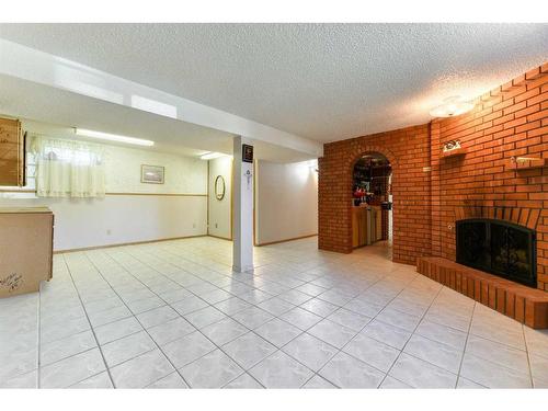 56 Huntwick Way Ne, Calgary, AB - Indoor With Fireplace