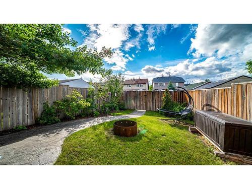 153 Elgin Meadows View Se, Calgary, AB - Outdoor With Backyard