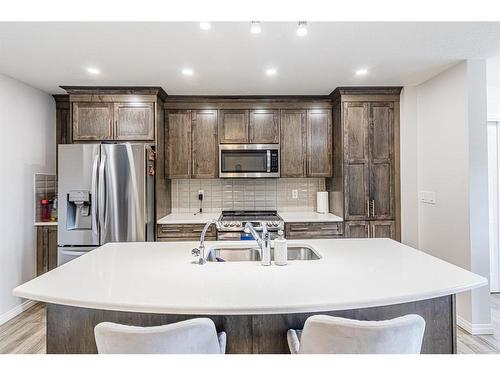 14 Yorkstone Walk Sw, Calgary, AB - Indoor Photo Showing Kitchen With Double Sink With Upgraded Kitchen